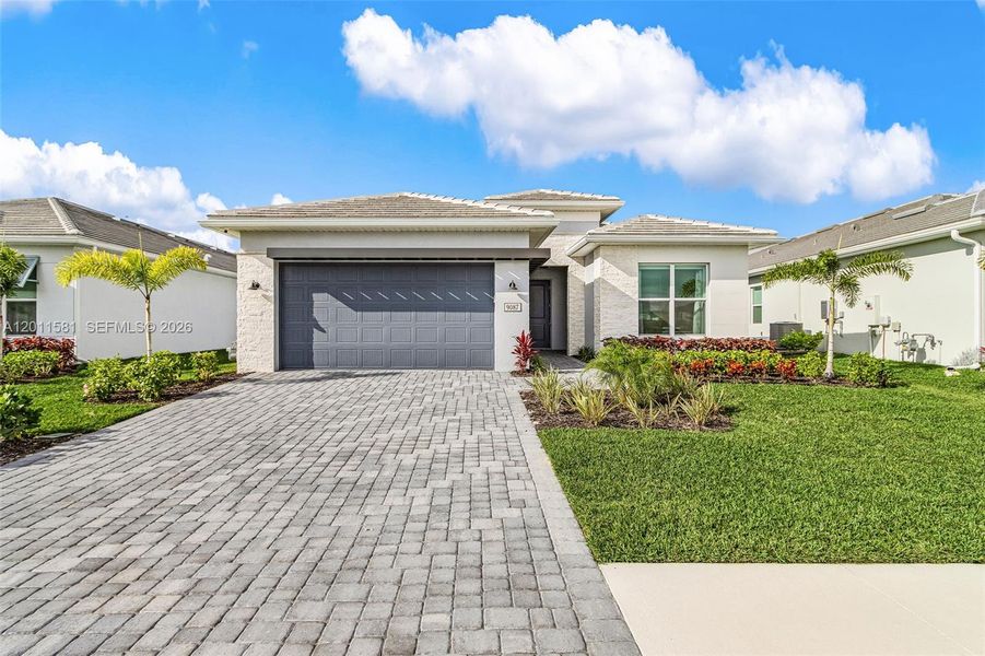 Front exterior of a new home in , Naples, FL, highlighting curb appeal (Image 2). Front exterior of a new home in , Naples, FL, highlighting curb appeal (Image 2).