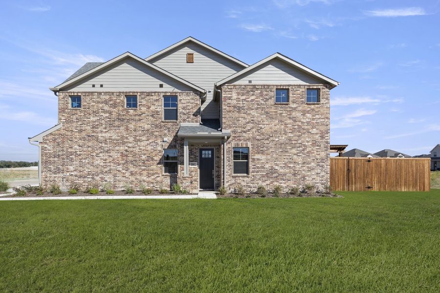 Exterior details and patio area of a home in Wildridge, Oak Point (Image 3).