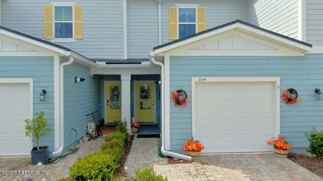 Front exterior of a new home in , Jacksonville, FL, highlighting curb appeal (Image 1).
