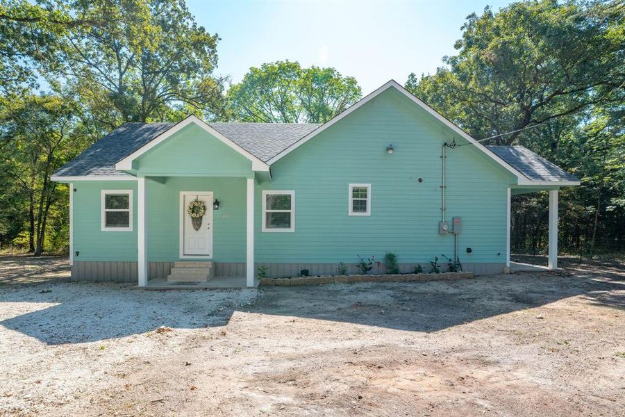 Front exterior of a new home in , Quinlan, TX, highlighting curb appeal (Image 21). Front exterior of a new home in , Quinlan, TX, highlighting curb appeal (Image 21).