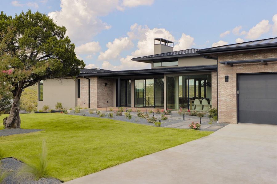 Front exterior of a new home in , Austin, TX, highlighting curb appeal (Image 24). Front exterior of a new home in , Austin, TX, highlighting curb appeal (Image 24).