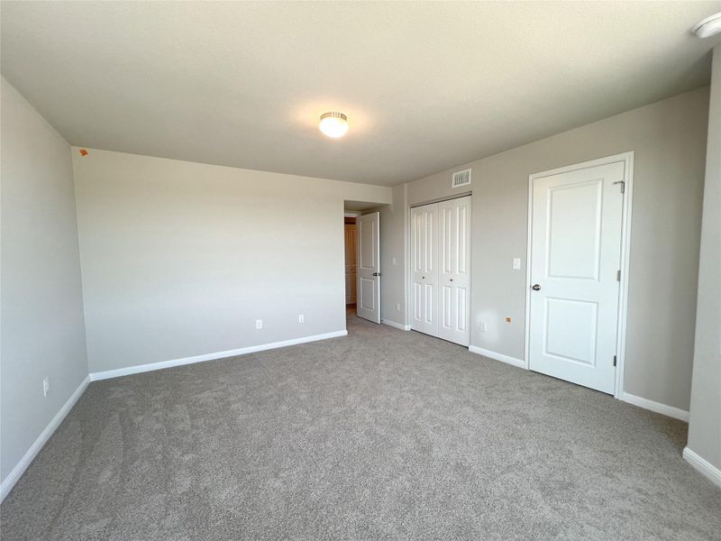 Unfurnished bedroom featuring baseboards, visible vents, a closet, and carpet flooring Unfurnished bedroom featuring baseboards, visible vents, a closet, and carpet flooring