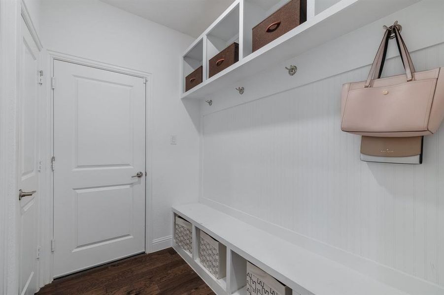 Mudroom featuring dark wood finished floors