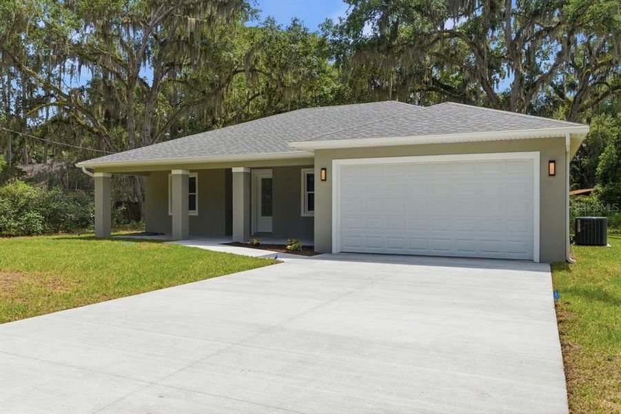 Front exterior of a new home in , Deland, FL, highlighting curb appeal (Image 25).