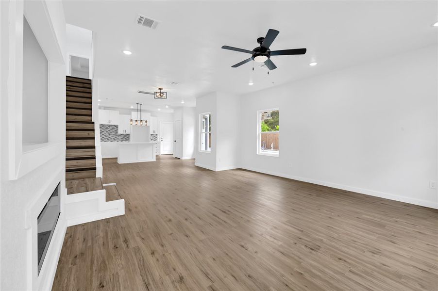 Spacious living room with soaring ceilings and natural light. Spacious living room with soaring ceilings and natural light.