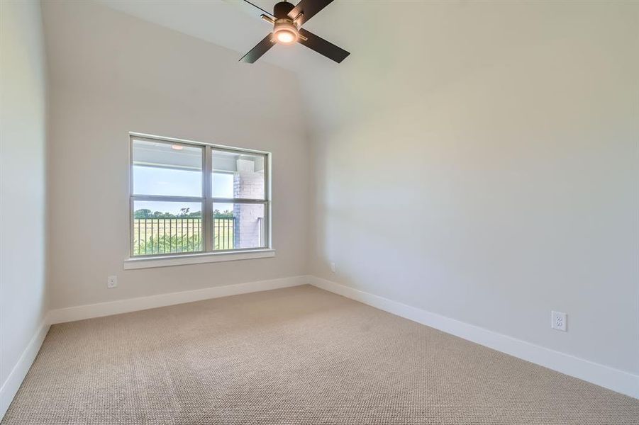Spare room featuring light carpet and ceiling fan Spare room featuring light carpet and ceiling fan