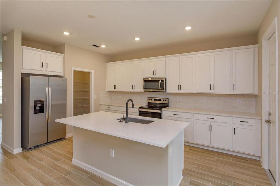 Furnished interior view inside a new home in Serenade at Ovation, Winter Garden (Image 12).