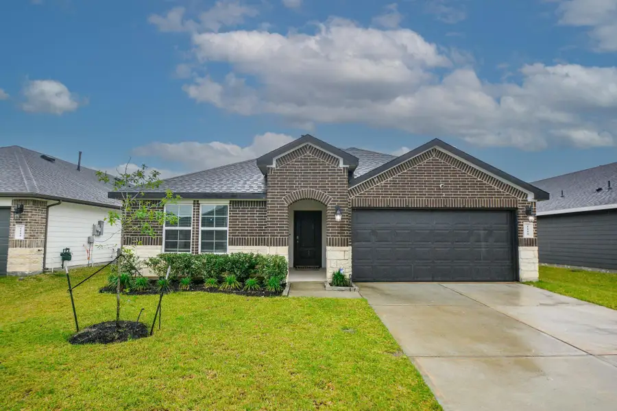 Front exterior of a new home in , Rosharon, TX, highlighting curb appeal (Image 2).