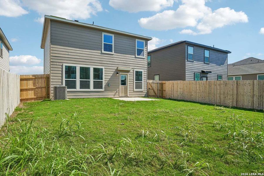 Exterior details and patio area of a home in Medina Crossing, Von Ormy (Image 4).