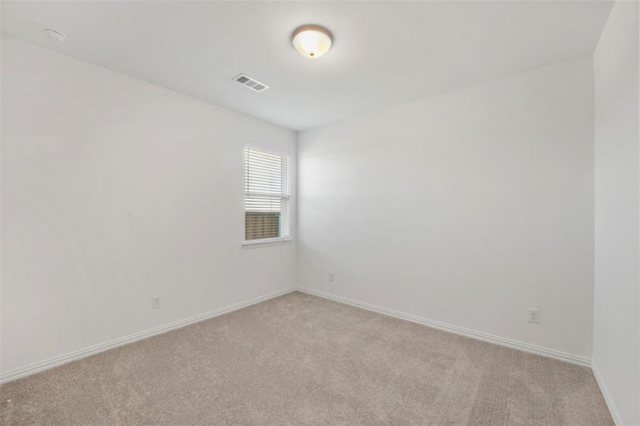 Unfurnished room with light colored carpet