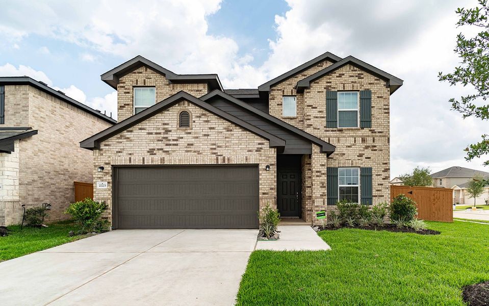 Front exterior of a new home in Cypress Green, Hockley, TX, highlighting curb appeal (Image 1).
