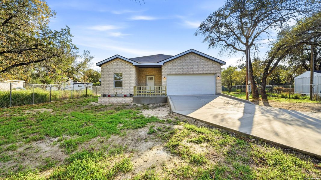 Front exterior of a new home in , Elmendorf, TX, highlighting curb appeal (Image 1). Front exterior of a new home in , Elmendorf, TX, highlighting curb appeal (Image 1).