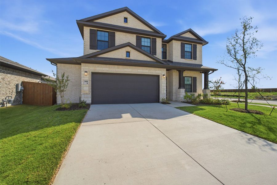 Front exterior of a new home in Heartland, Crandall, TX, highlighting curb appeal (Image 20).