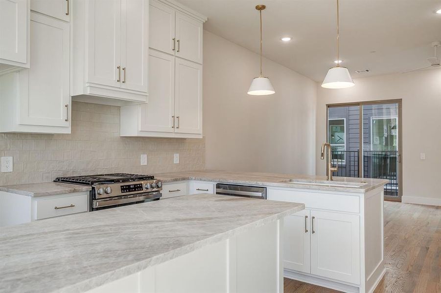 Sleek and spacious kitchen perfect for entertaining or everyday cooking. Sleek and spacious kitchen perfect for entertaining or everyday cooking.