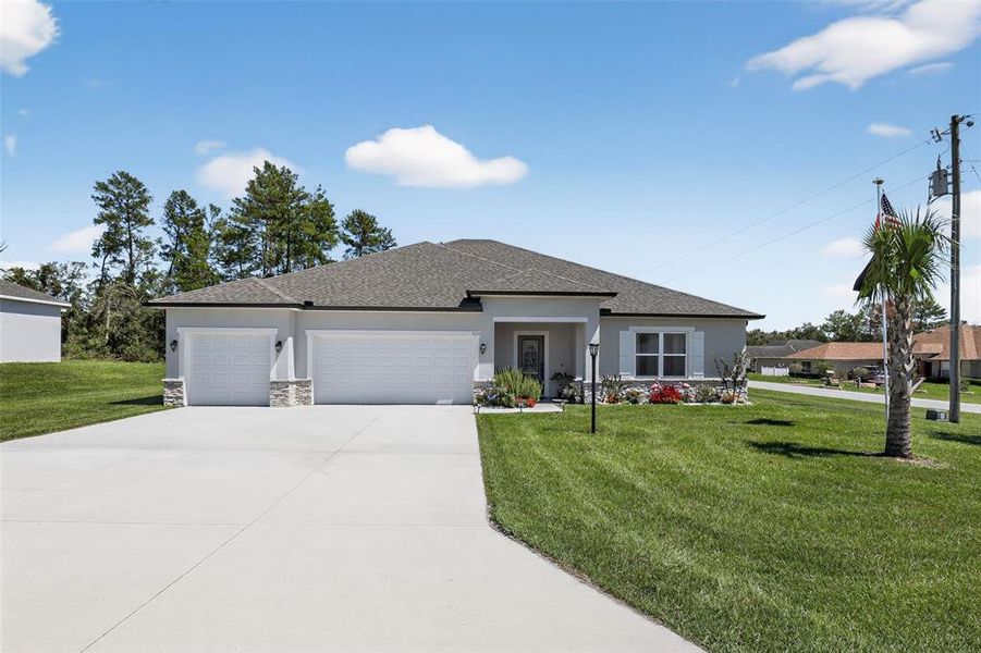 Front exterior of a new home in , Ocala, FL, highlighting curb appeal (Image 2). Front exterior of a new home in , Ocala, FL, highlighting curb appeal (Image 2).