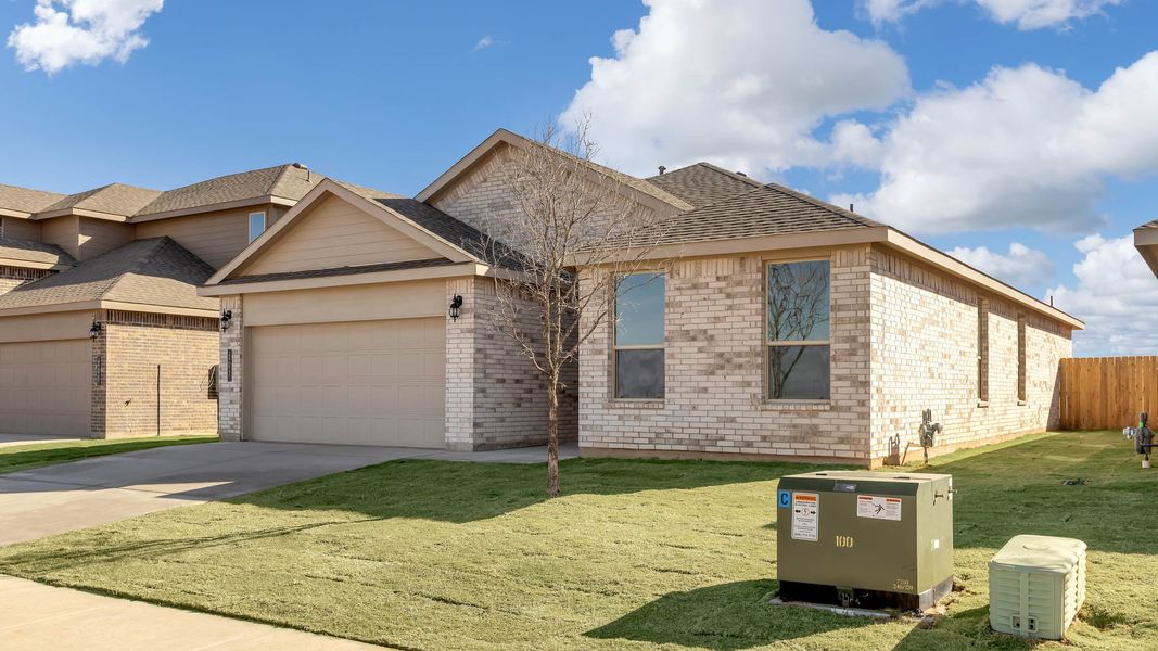Front exterior of a new home in Overlook West, Wolfforth, TX, highlighting curb appeal (Image 2). Front exterior of a new home in Overlook West, Wolfforth, TX, highlighting curb appeal (Image 2).