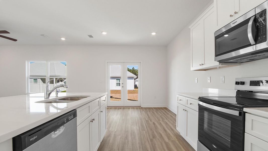 Furnished interior view inside a new home in Bayside at Ward Creek, Panama City Beach (Image 9).