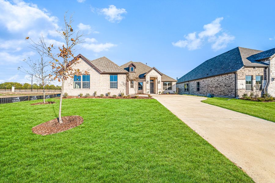 Front exterior of a new home in Forest Ridge Estates, Greenville, TX, highlighting curb appeal (Image 20).