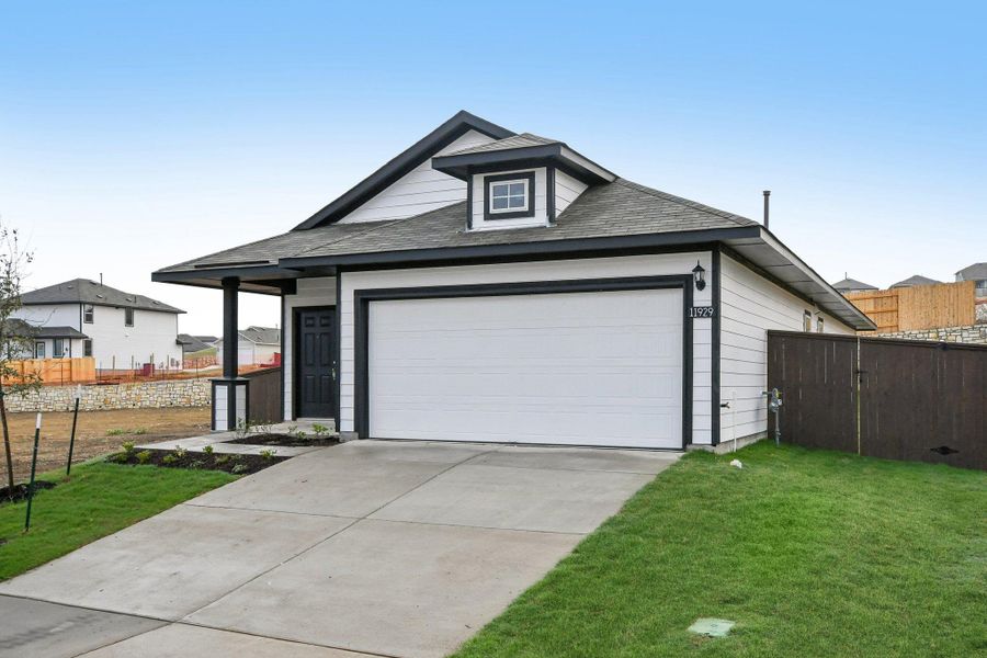 Front exterior of a new home in Cloverleaf, Austin, TX, highlighting curb appeal (Image 21).