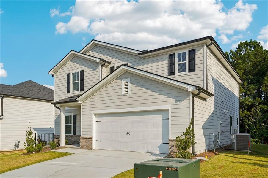 Front exterior of a new home in Ivey Township, Dallas, GA, highlighting curb appeal (Image 2). Front exterior of a new home in Ivey Township, Dallas, GA, highlighting curb appeal (Image 2).