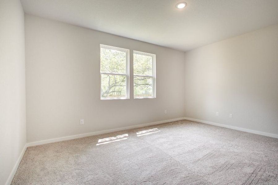 A room with a carpet and windows. A room with a carpet and windows.