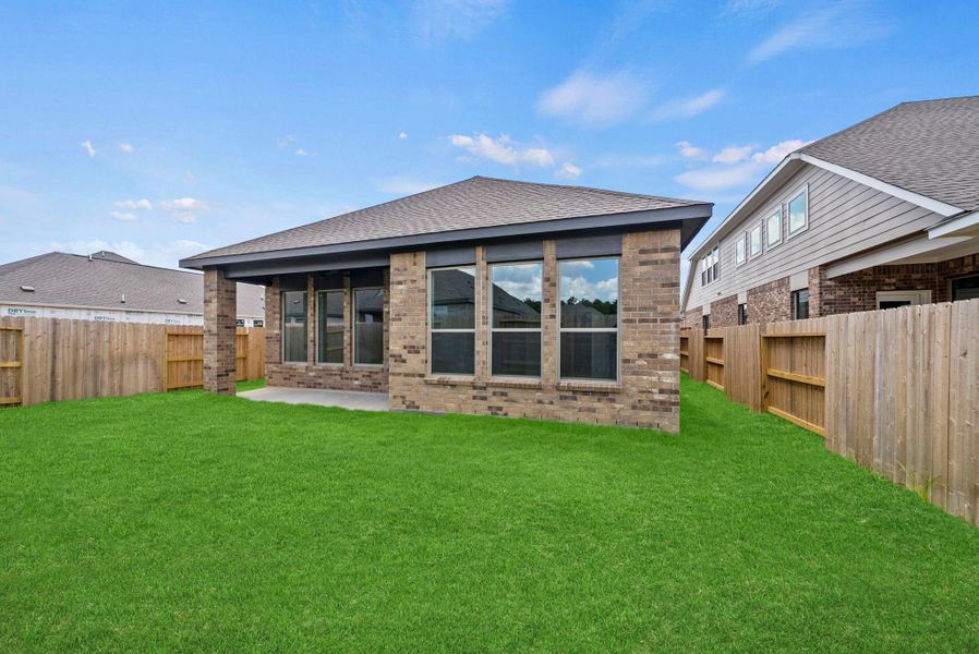 Exterior details and patio area of a home in The Trails, New Caney (Image 3).