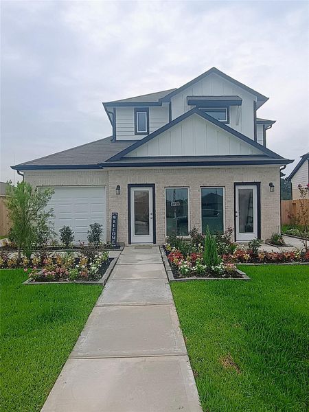 Front exterior of a new home in Enclave at Willis, Willis, TX, highlighting curb appeal (Image 2).