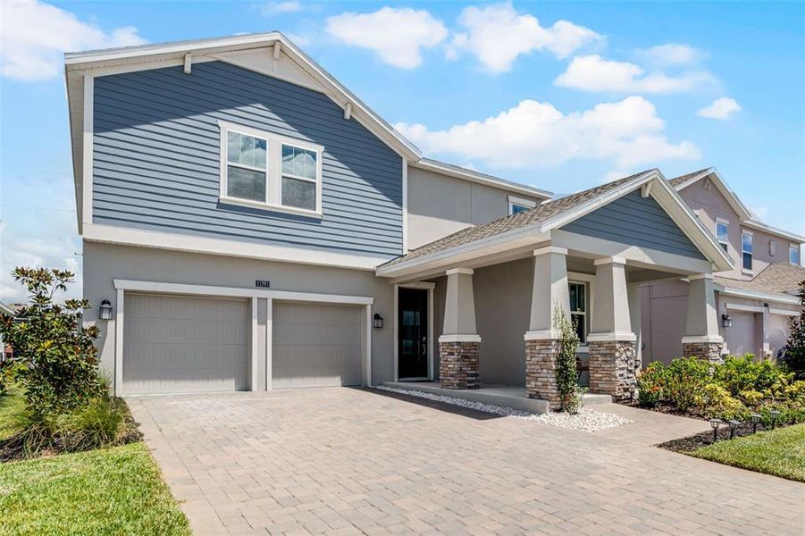 Front exterior of a new home in , Orlando, FL, highlighting curb appeal (Image 1).
