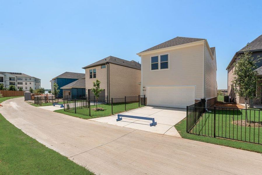 Front exterior of a new home in Bayside, Rowlett, TX, highlighting curb appeal (Image 20).