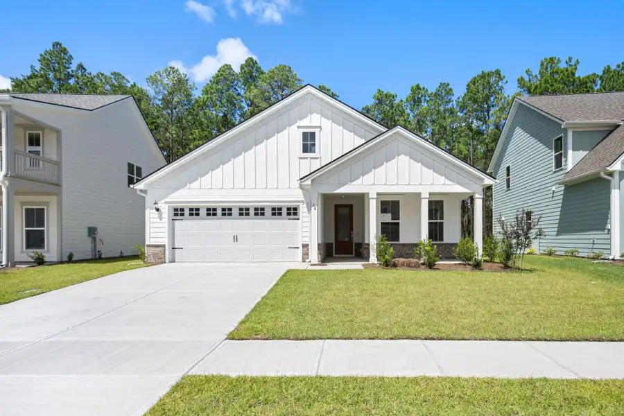 Front exterior of a new home in Waterways, Richmond Hill, GA, highlighting curb appeal (Image 31).