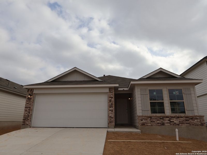 Front exterior of a new home in Agave, San Antonio, TX, highlighting curb appeal (Image 21).
