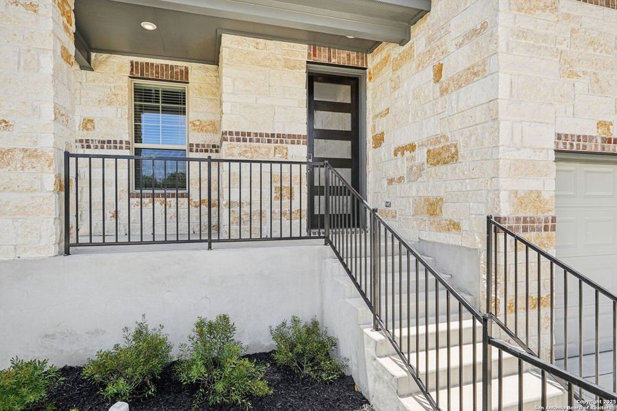 Front exterior of a new home in Comanche Ridge, San Antonio, TX, highlighting curb appeal (Image 2). Front exterior of a new home in Comanche Ridge, San Antonio, TX, highlighting curb appeal (Image 2).