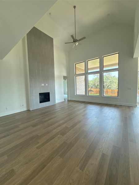 Open Concept Kitchen with soaring ceiling & fireplace