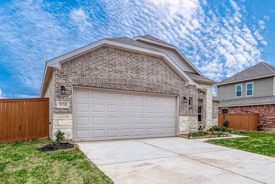 Representative exterior photo of a completed home built from the Floor Plan 1830 by Colina Homes in Grand Magnolia, Magnolia, TX (Image 26). Representative exterior photo of a completed home built from the Floor Plan 1830 by Colina Homes in Grand Magnolia, Magnolia, TX (Image 26).