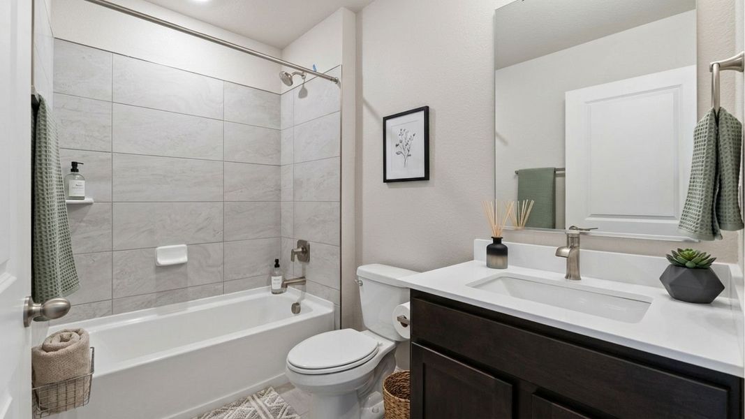 Representative furnished interior of a home built from the Douglas by D.R. Horton in Horizon Uptown, Aurora (Image 13).