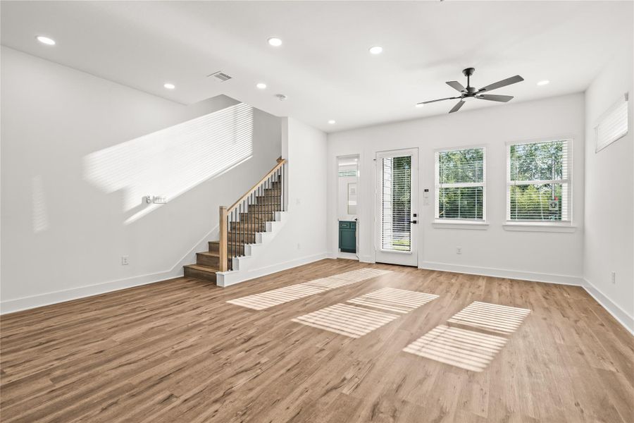 Your final look before heading upstairs. A commanding view of the main floor that perfectly demonstrates true open-concept luxury.