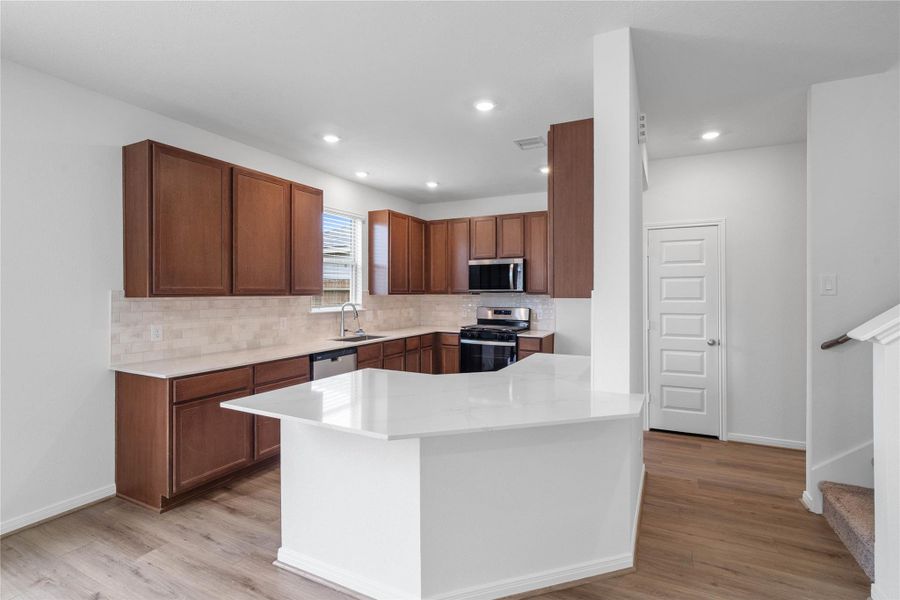 This spacious kitchen has it all—ample storage, generous counter space, and a layout that truly makes it the heart of the home. This spacious kitchen has it all—ample storage, generous counter space, and a layout that truly makes it the heart of the home.