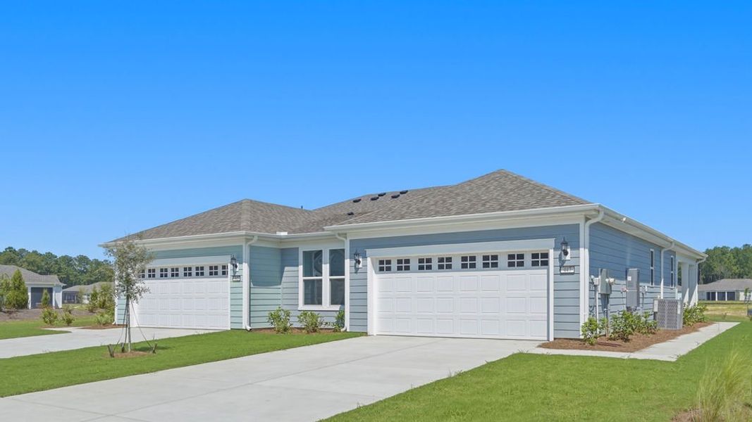 Front exterior of a new home in Sun City Hilton Head, Bluffton, SC, highlighting curb appeal (Image 22).