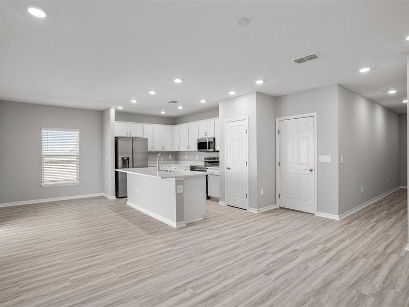 Enjoy a sunny, open living area, with LVP flooring throughout the first floor.