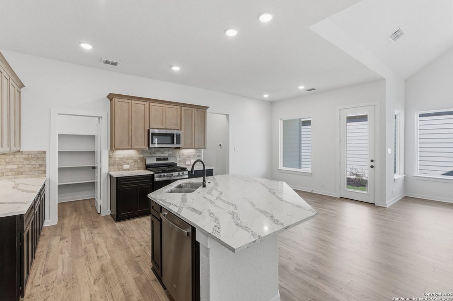 Furnished interior view inside a new home in The Crossvine – Garden Homes, Schertz (Image 7).