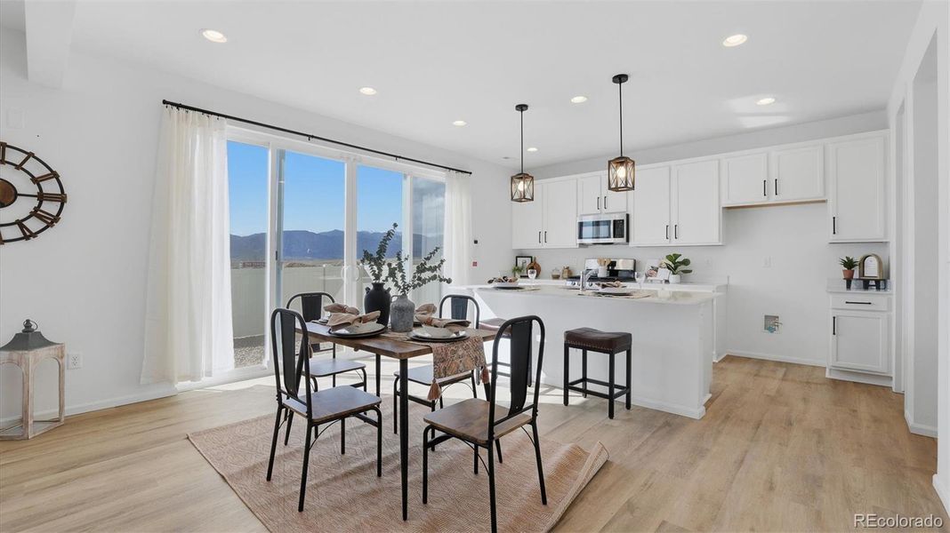 The Dining Area has a slider to the fenced backyard.