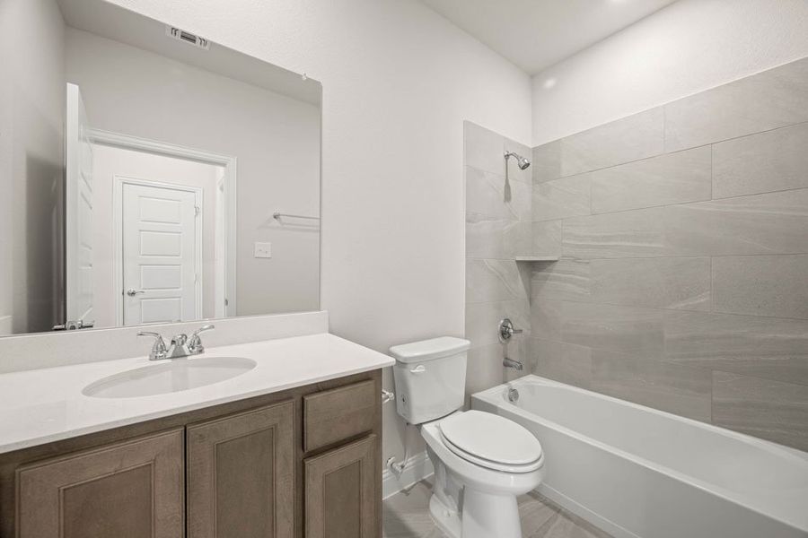 Front exterior of a new home in Redden Farms – Active Adult, Midlothian, TX, highlighting curb appeal (Image 25). Front exterior of a new home in Redden Farms – Active Adult, Midlothian, TX, highlighting curb appeal (Image 25).