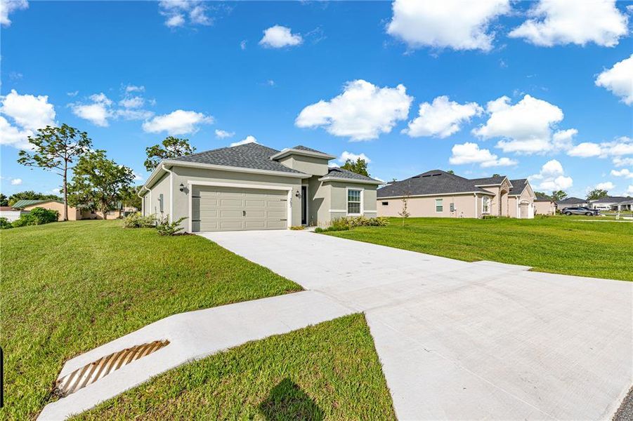 Front exterior of a new home in , Ocala, FL, highlighting curb appeal (Image 27).