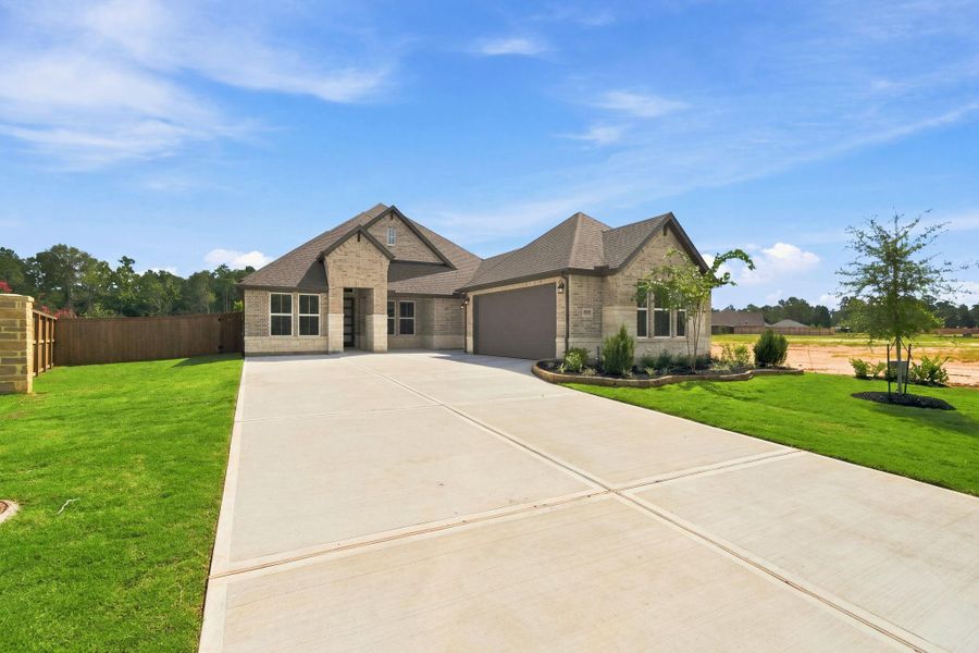 Front exterior of a new home in The Highlands, Porter, TX, highlighting curb appeal (Image 25).