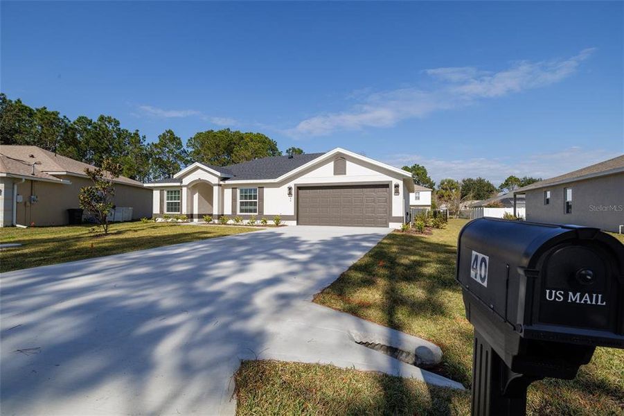 Front exterior of a new home in , Palm Coast, FL, highlighting curb appeal (Image 18).