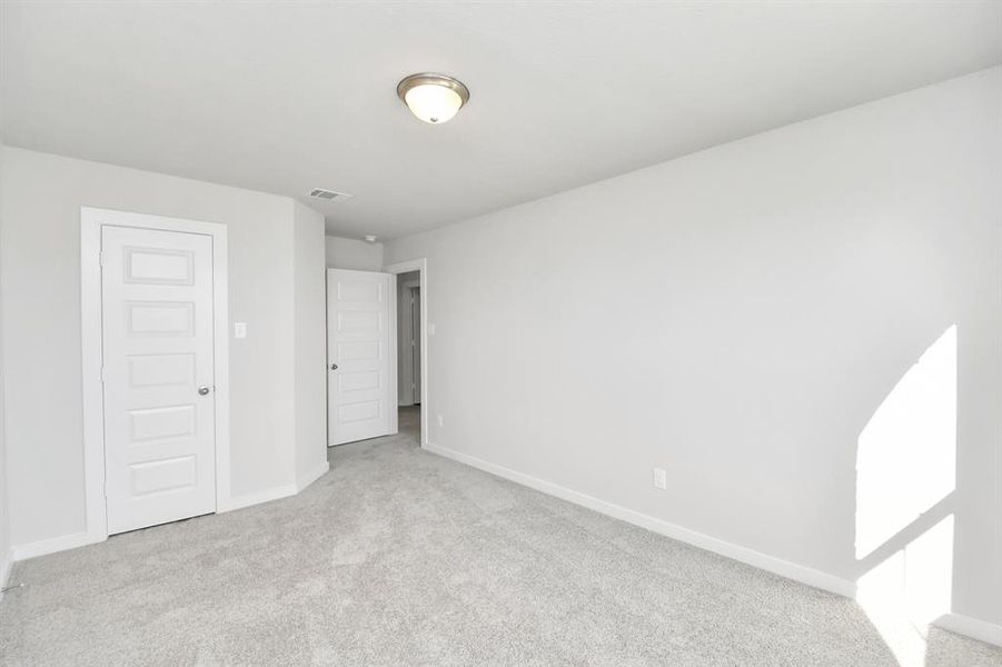 Generously sized secondary bedrooms featuring spacious closets, soft and inviting carpetingunderfoot, large windows allowing plenty of natural light, and the added touch of privacyblinds for your personal retreat.