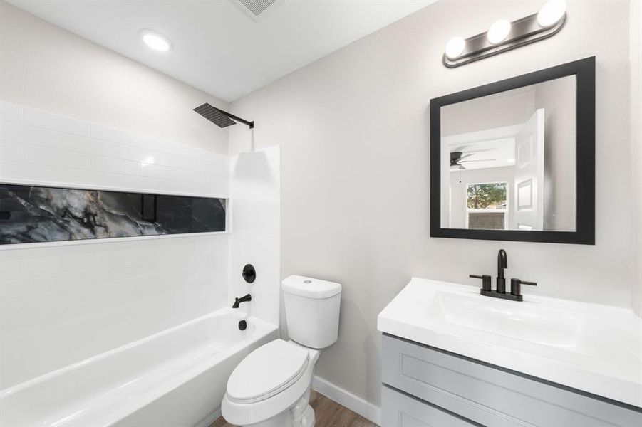 Full bathroom featuring shower / washtub combination and vanity Full bathroom featuring shower / washtub combination and vanity