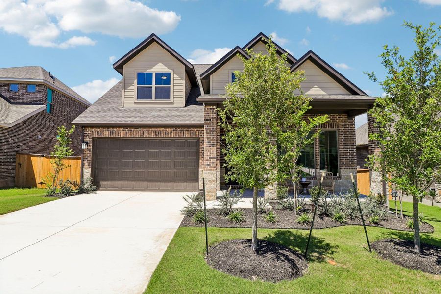 Front exterior of a new home in 6 Creeks, Kyle, TX, highlighting curb appeal (Image 2). Front exterior of a new home in 6 Creeks, Kyle, TX, highlighting curb appeal (Image 2).