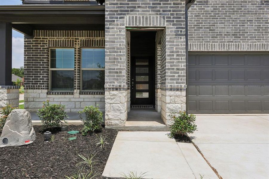 Front exterior of a new home in Westmoor, Sherman, TX, highlighting curb appeal (Image 18).
