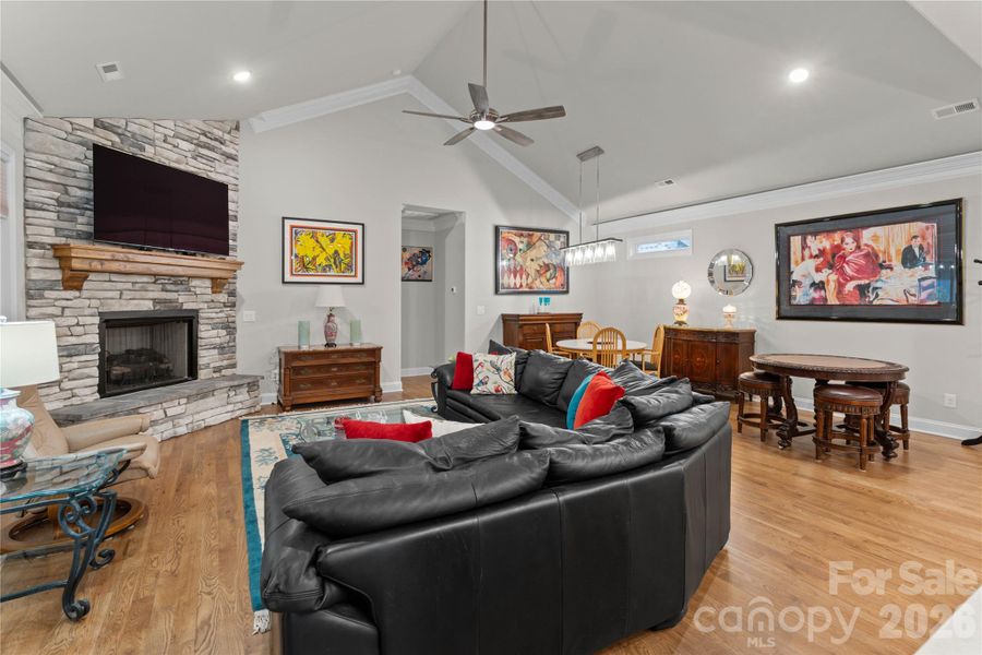 Attractive stone, floor to ceiling fireplace with hearth seating.  TV remains with the home.